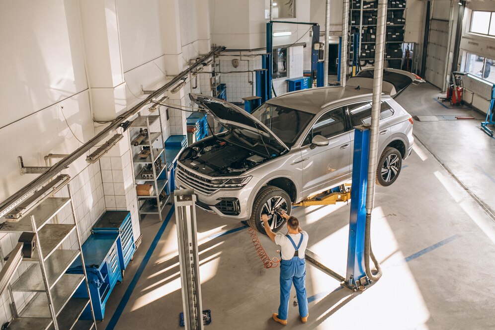 auto-mechanic-checking-car_1303-14042